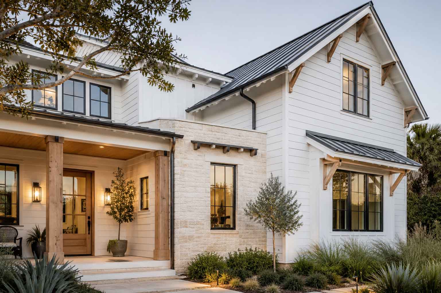 Modern coastal home exterior with white siding and black windows on the Gulf Coast